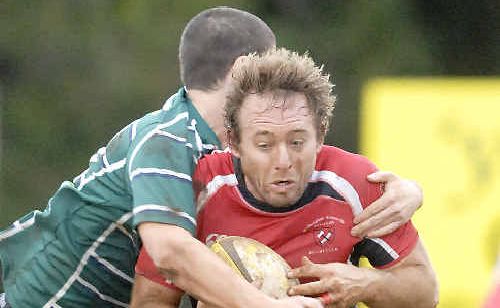 Wollongbar centre Arlo Cluff takes a tackle while running the ball against Lismore City on Saturday. Wollongbar centre Arlo Cluff takes a tackle while running the ball against Lismore City on Saturday.